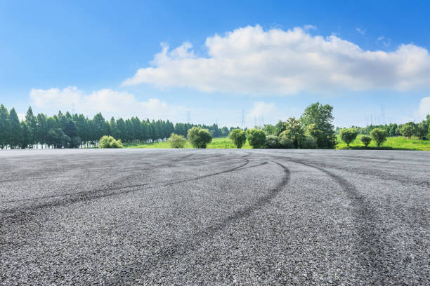 istock empty asphalt road and green forest in summer 943624614