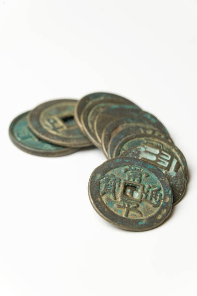 istock Ancient Chinese bronze coins on white background 943627028