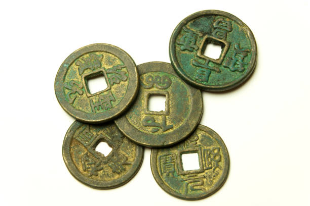 istock Ancient Chinese bronze coins on white background 943627032