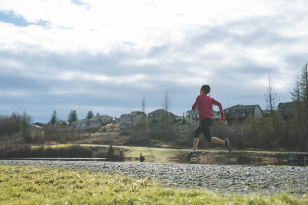 istock A young Eurasian woman goes for a training run next to a lake 943628142