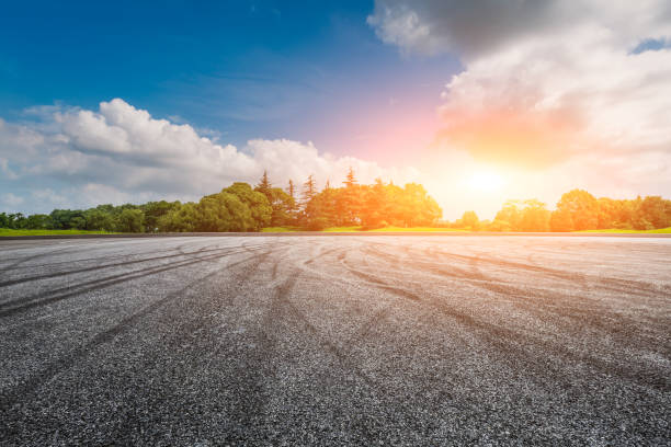 istock empty asphalt road ground and green forest 943633790