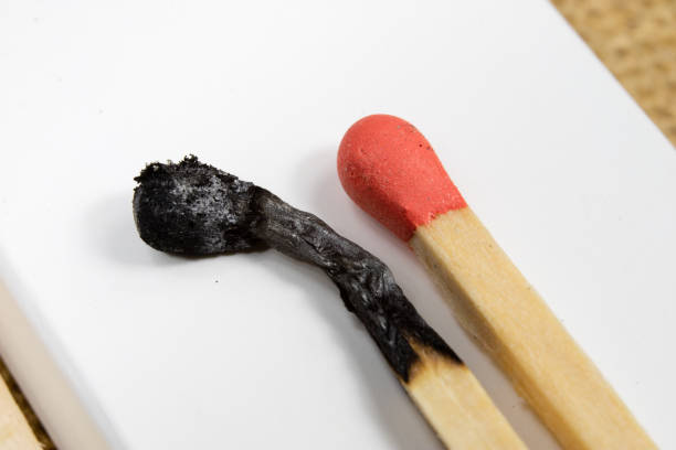 istock Matches in high magnification. Accessories for lighting a fire and bonfire. Dark background. 943633968