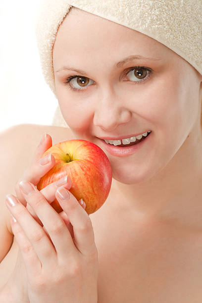 istock closeup woman portrait with apple 94363566