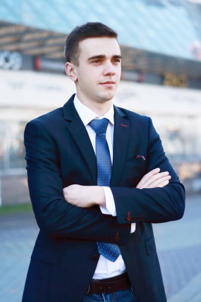 istock confident young businessman on background of office 943639370