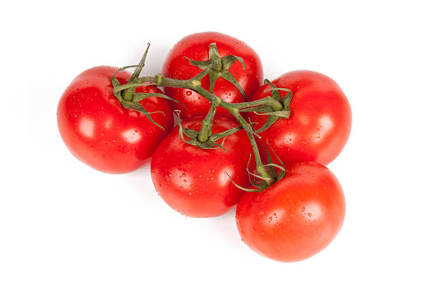 istock Branch of fresh tomatoes with water droplets isolated 94364133