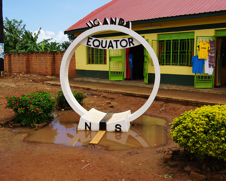 a point in Uganda, which shows the course of the equator