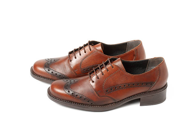 istock Two brown shoes isolated on white 94364396