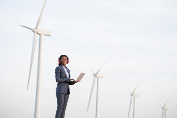 istock Renewable energy engineer woman at wind farm. 943646144
