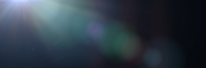 mainly off screen lens flare effect overlay banner texture with bokeh and lens distortion effects in front of a black background