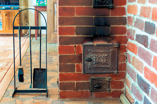 view of the stove and accessories close-up in a wooden country house close-up