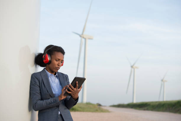 istock Sustainable energy engineer working at wind farm. 943655488