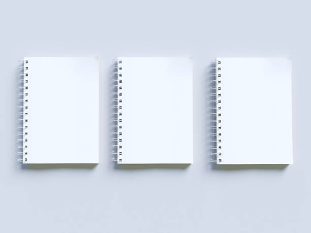 istock Empty photorealistic mock-up notebook on a light gray background, 3d illustration. 943655800