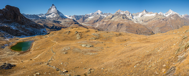 A panorama from the tourist destination of Gornergratt above the Swiss alps town of Zermatt, Valais. The Matterhorn and surrounding peaks of the alps in the background