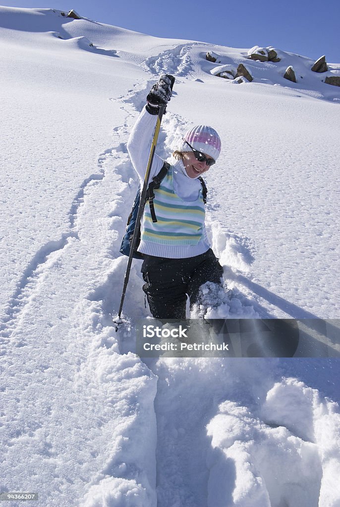 Woman on a snow path in mountains  Active Lifestyle Stock Photo
