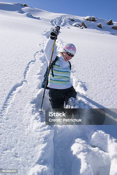 Woman On A Snow Path In Mountains Stock Photo - Download Image Now - Active Lifestyle, Activity, Adult