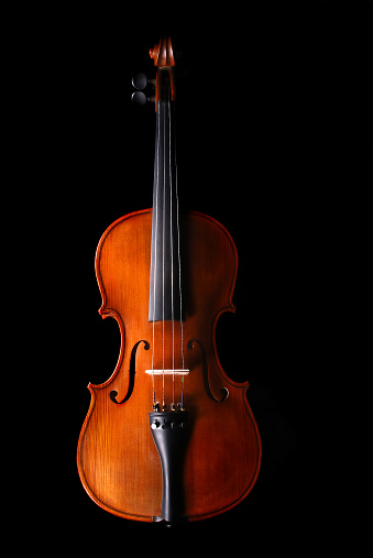 Violin on wooden background with copy space for music concept or poster
