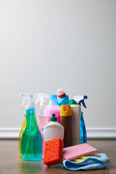 istock bottles with cleaners and spray bottles on floor for spring cleaning 943671162