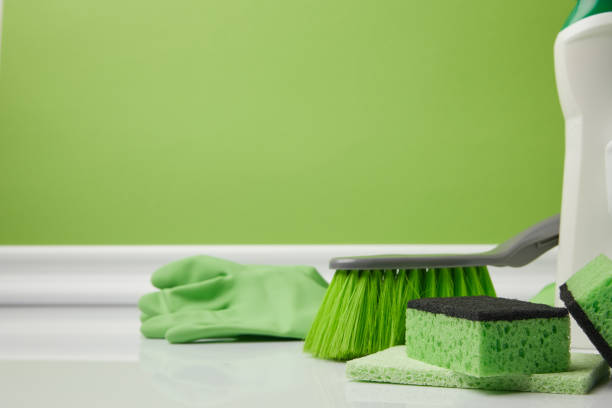 istock green brush and washing sponges for spring cleaning 943671604