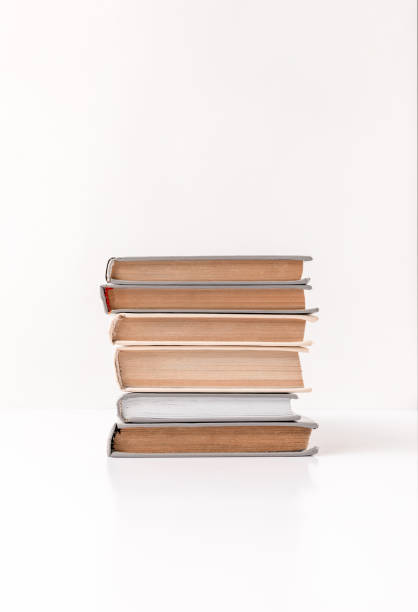 istock Front view of stack of different books isolated on white 943674692