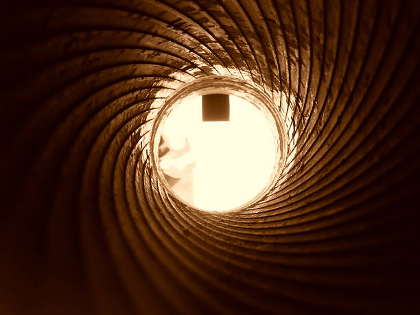istock View of cannon barrel on the inside, sepia 94367616