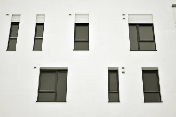 istock Facade of a modern apartment building. Black and white. 943688780