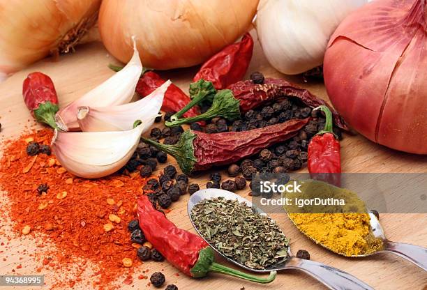 Colorful Array Of Spices Chilies And Garlic Stock Photo - Download Image Now - Black Peppercorn, Chili Pepper, Garlic
