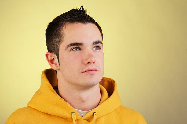istock young boy in yellow sweatshirt 94369590