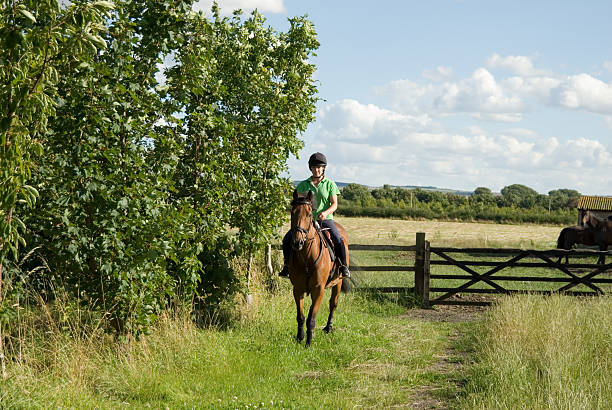 young lady with her dog off for a ride in the English countryside