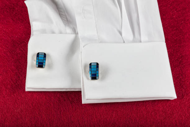 Close-up of cufflink on men's white shirt