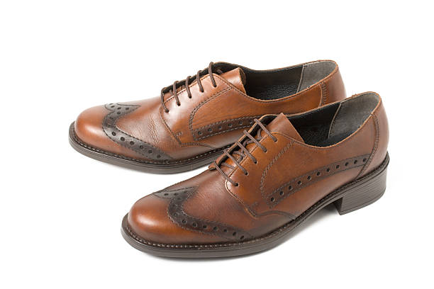 istock Two brown shoes isolated on white 94370249