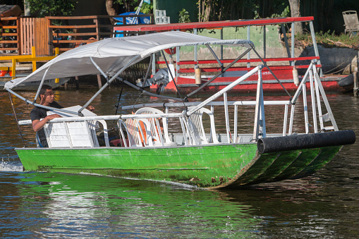 Tourist boat in the Marapendi Natural Reserve, a coastal nature preserve in the area of Barra da Tijuca not far from the centre of Rio de Janeiro