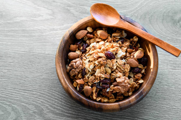 istock homemade granola with nuts in wooden bowl 943706342