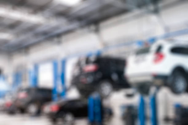 istock Blurred scene cars lifting repair check and fix a problem 943710070