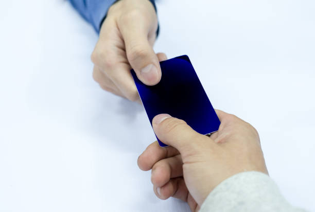 istock Hand paying credit card with staff cashier 943710152