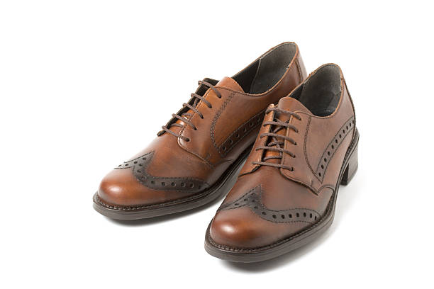istock Two brown shoes isolated on white 94371467
