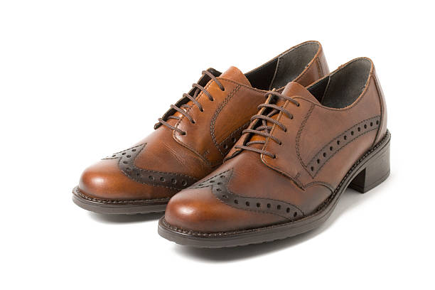 istock Two brown shoes isolated on white 94371482