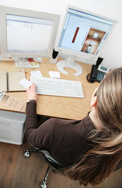 istock young architect in front of her monitor 94371507