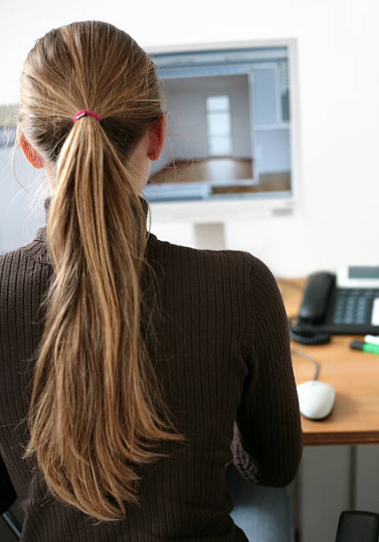 istock young architect in front of her monitor 94371512
