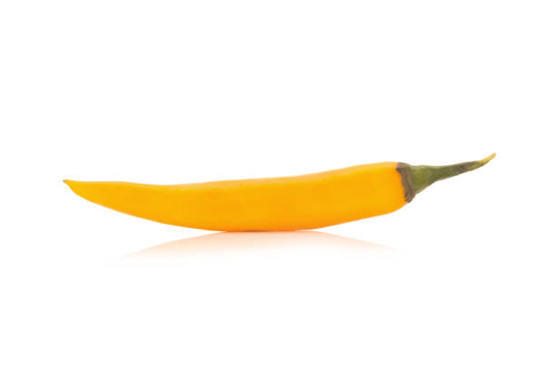 istock chili pepper yellow / orange isolated on a white background 943718960