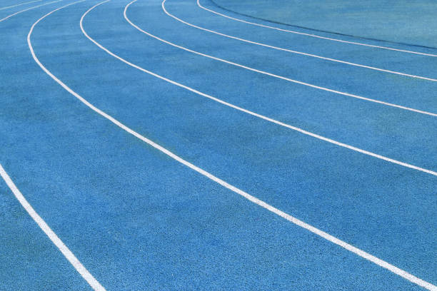 istock Fragment of blue surface of running tracks 943719026