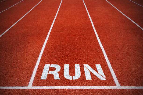 istock Fragment of rubber surface running tracks with inscription 
