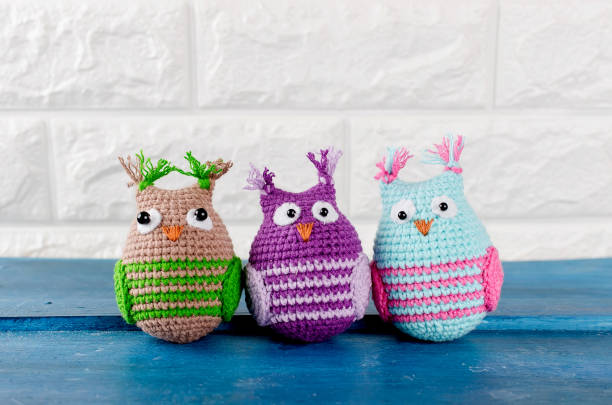istock three Cute handmade knitted owls toys 943719112