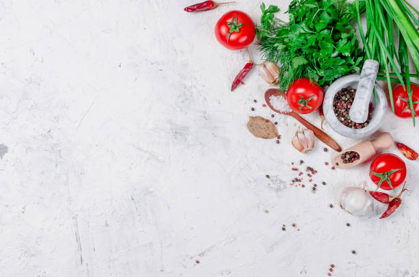 istock cherry tomatoes on a branch, oil,  parsley and spice 943721790