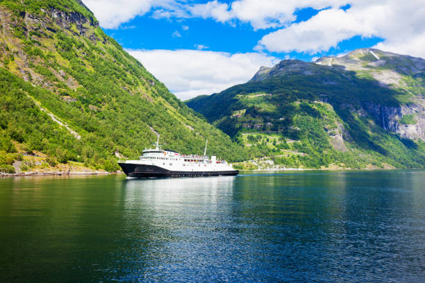 Tourist boat at the Geirangerfjord near the Geiranger village, Norway