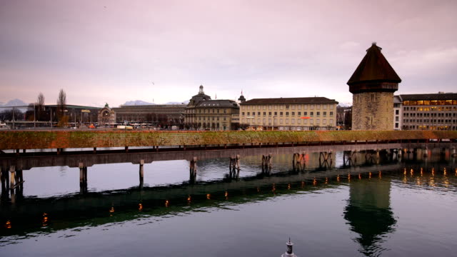 Twilight landscape of city reflect by water in Luzern