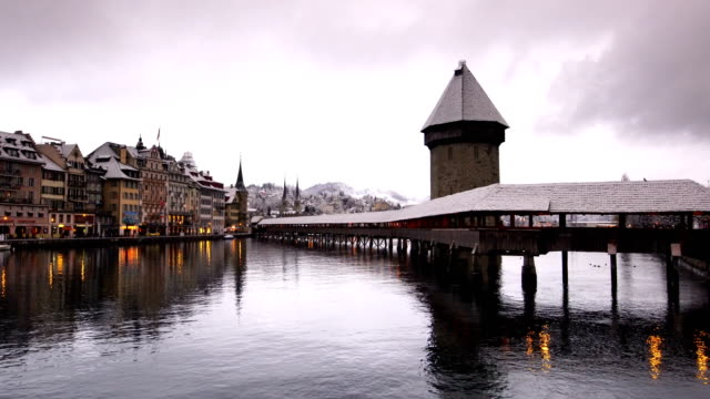 Twilight landscape of city reflect by water in Luzern