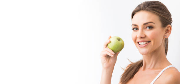 istock Woman with holding green apple 943730262