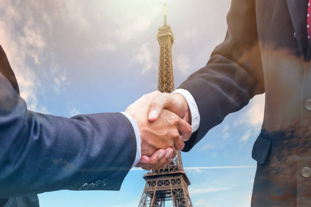 istock Handshake agreement of businessman with partnership on eiffel tower 943730348