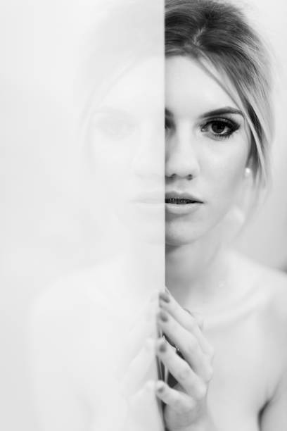 istock Reflection Of Beautiful Woman In Mirror 943730520