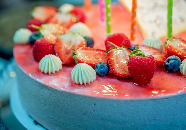 istock Cheesecake decorated with fresh strawberries, blueberries and raspberries 943733138